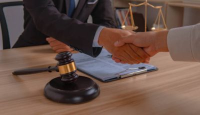 business people and lawyers discussing contract papers sitting at the table. Concepts of law, advice, legal services. in morning light.